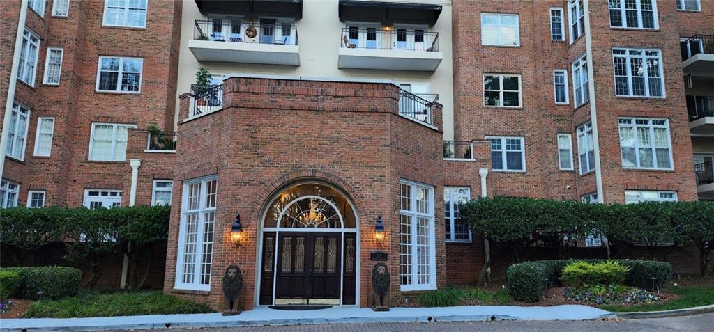 175 15th Street Northeast, Unit 213 Atlanta, GA 30361 - Photo 1 of 1 a front view of a building with a garden