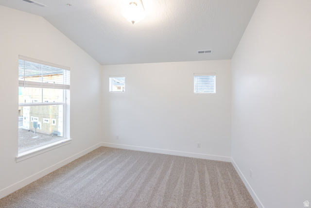 4661 Poplar Way, Unit R301 Mapleton, UT 84664 - Photo 10 of 17 Spare room featuring lofted ceiling and light carpet