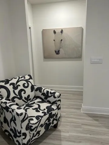 a view of a livingroom with furniture and wooden floor