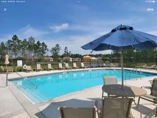 a view of a chairs and table in the patio