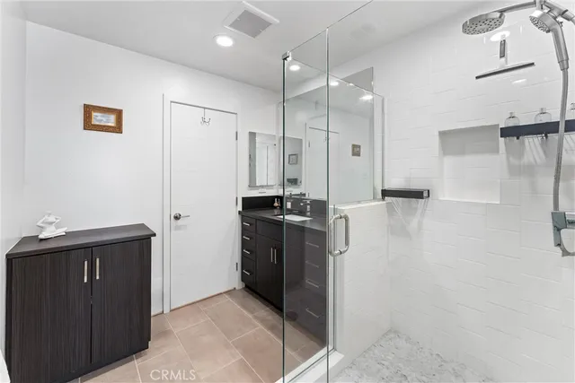 a kitchen with a refrigerator and a stove