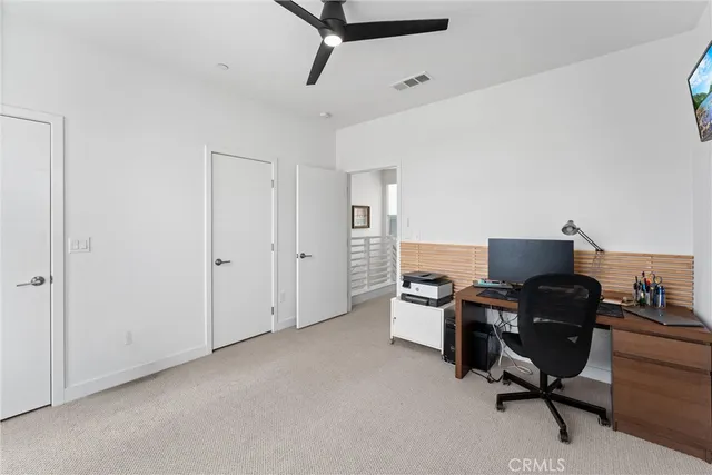 a view of a workspace with furniture