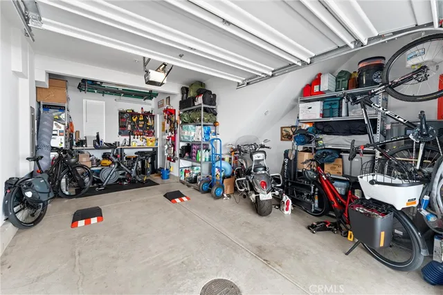 a view of a storage area with a bike and car