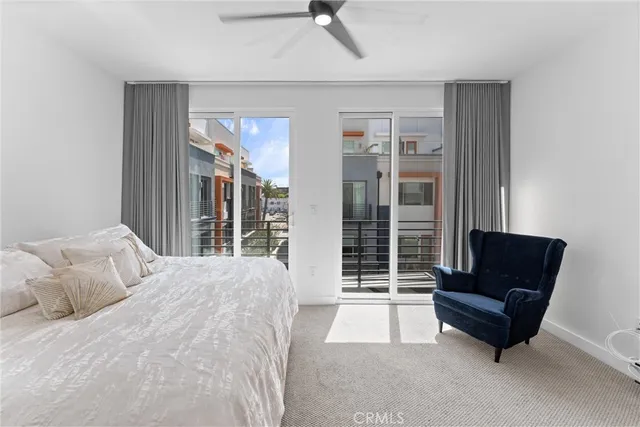 a bedroom with a bed and glass window
