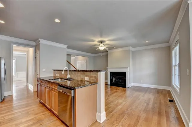 a stove top oven sitting inside of a kitchen