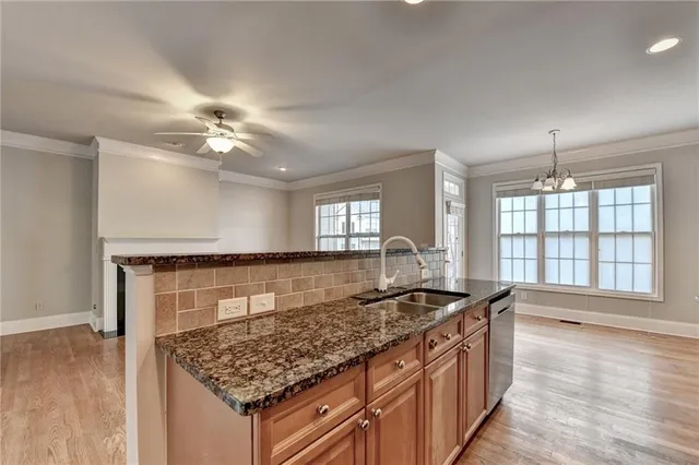 a view of an empty room with a ceiling fan