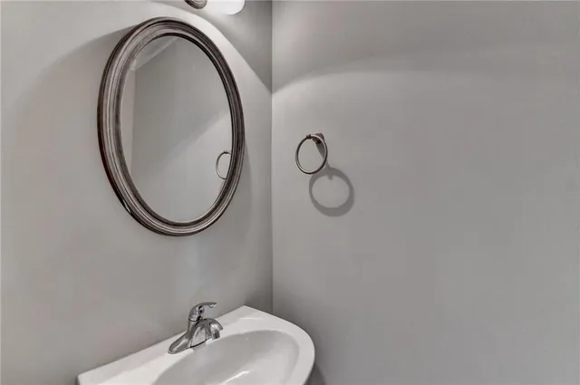 a spacious bathroom with a double vanity sink mirror and shower