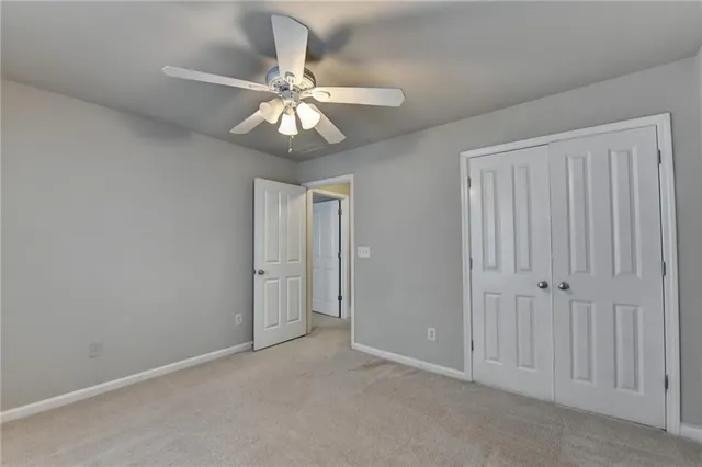 a view of backyard with outdoor seating and plants