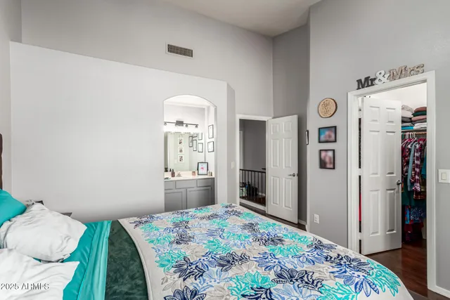 a bedroom with a bed and a dresser