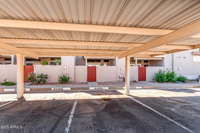 a view of a white house with a yard