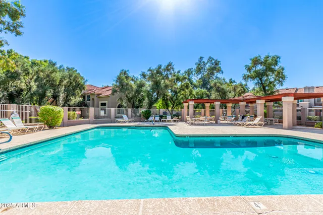 a view of a swimming pool with a patio