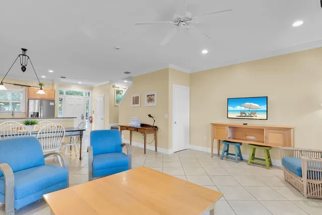 a dining room with furniture a window and a chandelier