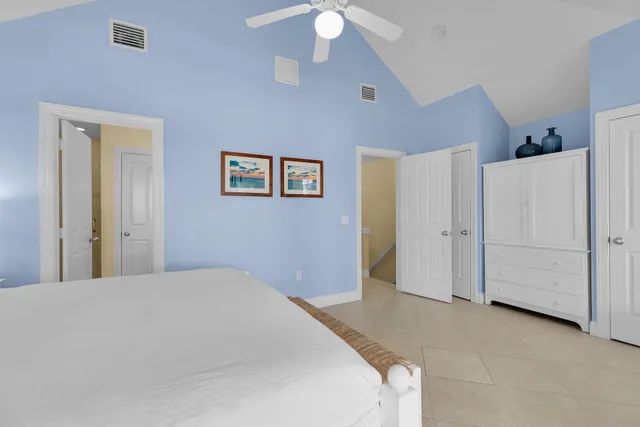 a bathroom with a granite countertop sink a mirror and a shower