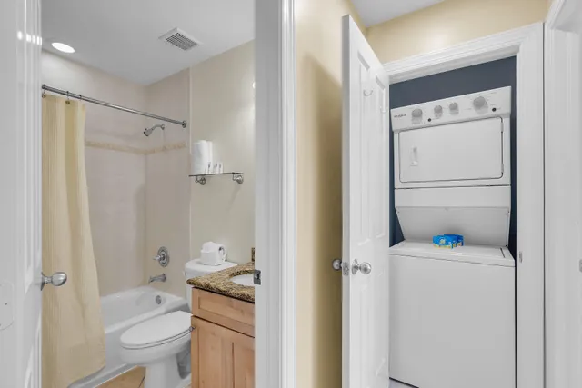 a bedroom with a bed and a lamp