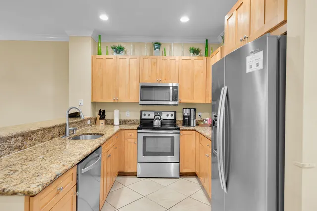 a kitchen with a sink and a refrigerator