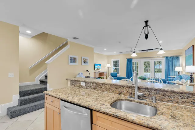 a view of a dining room with furniture a livingroom and wooden floor