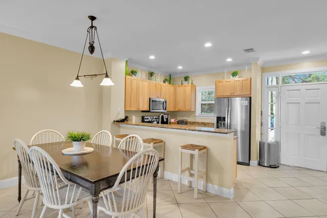 a view of a dining room with furniture window and outside view