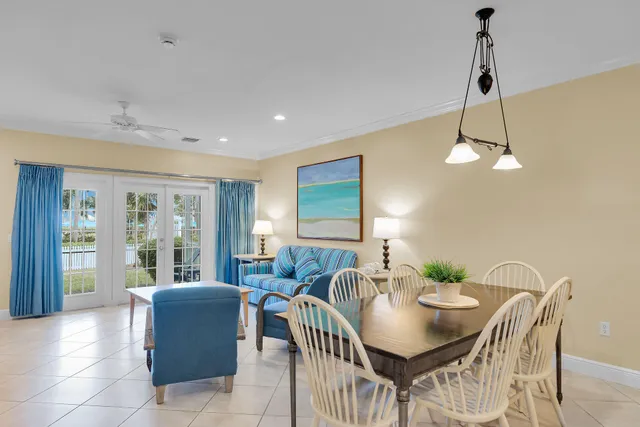 a living room with furniture and large window