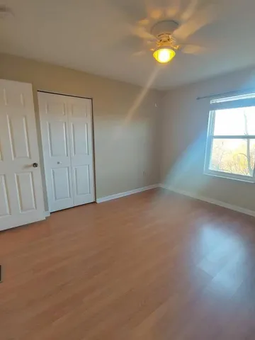 an empty room with windows and entrance