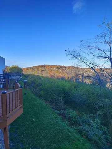 a view of a yard with an outdoor space and deck
