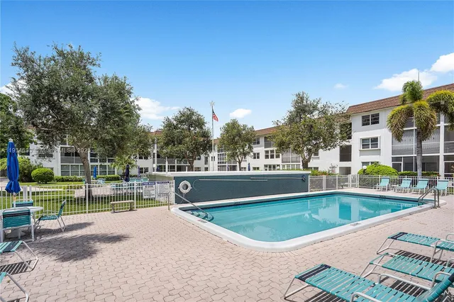 a view of outdoor space yard swimming pool and outdoor seating