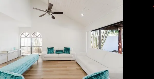 a bedroom with furniture and a window