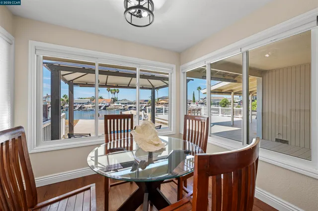 a view of a dining room with furniture window and wooden floor