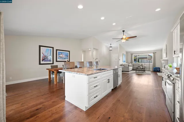 a dining room with furniture and wooden floor