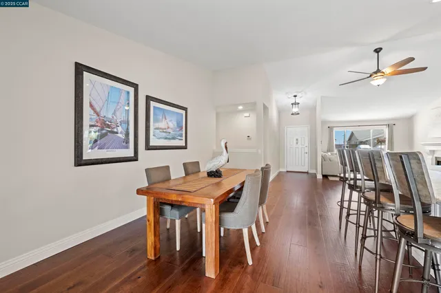 a living room with furniture a rug and a fireplace