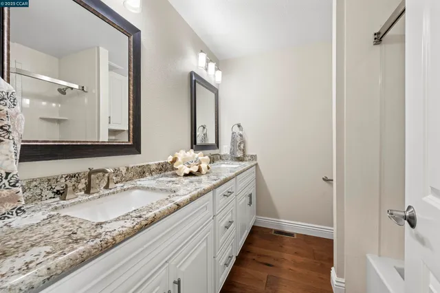 a bedroom with a bed lamp and a window