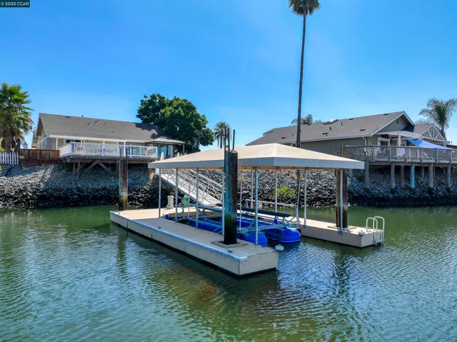 an aerial view of a house with outdoor space