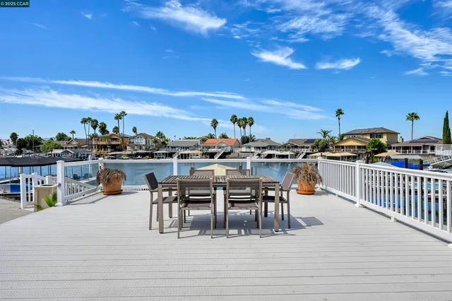 a view of a house with sitting area and garden