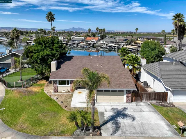 an aerial view of a house with outdoor space