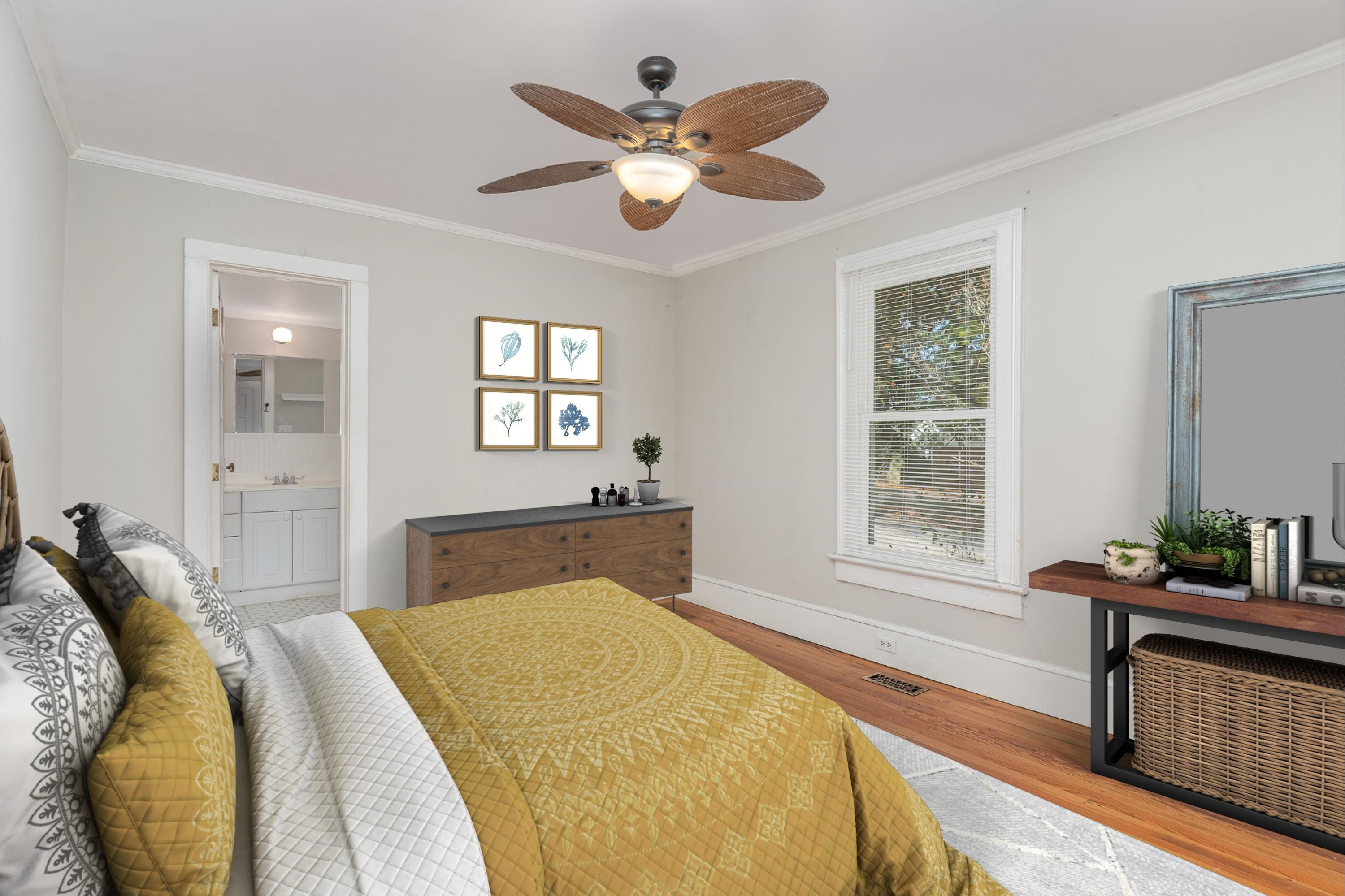 519 Holden Street Raleigh, NC 27604 - Photo 15 of 23 a bedroom with a large bed and a window