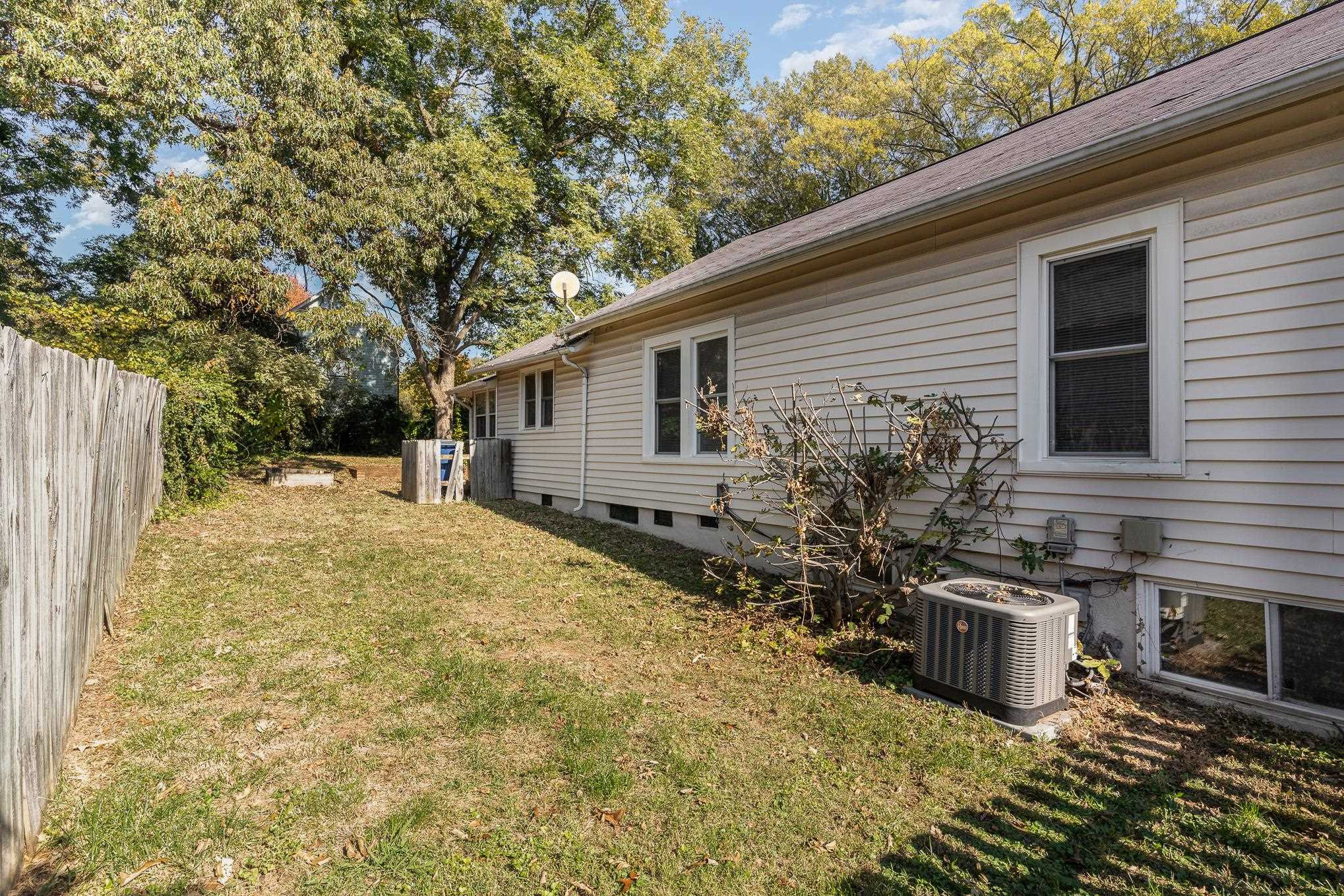 519 Holden Street Raleigh, NC 27604 - Photo 19 of 23 a backyard of a house with yard and outdoor seating