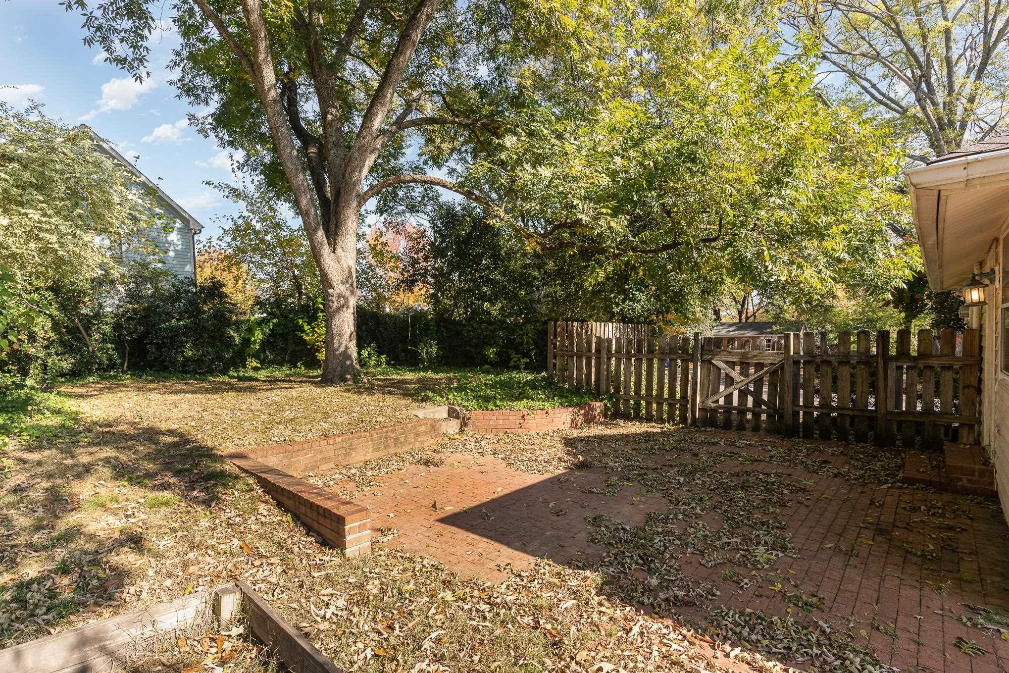 519 Holden Street Raleigh, NC 27604 - Photo 23 of 23 a view of a yard with wooden fence