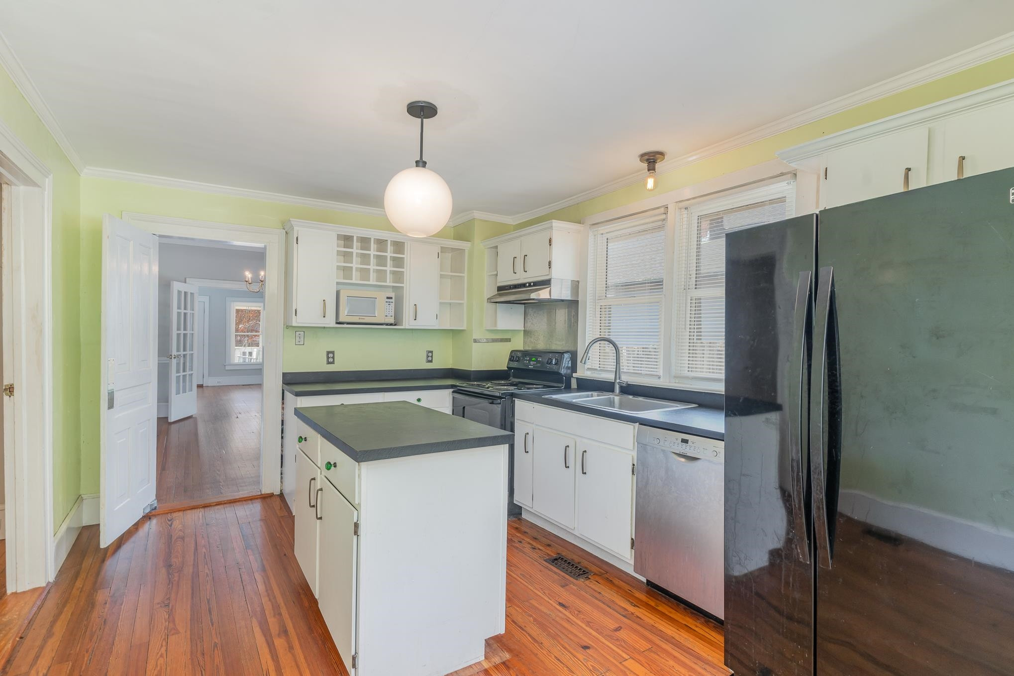 519 Holden Street Raleigh, NC 27604 - Photo 8 of 23 a kitchen with granite countertop a sink a counter space appliances and cabinets