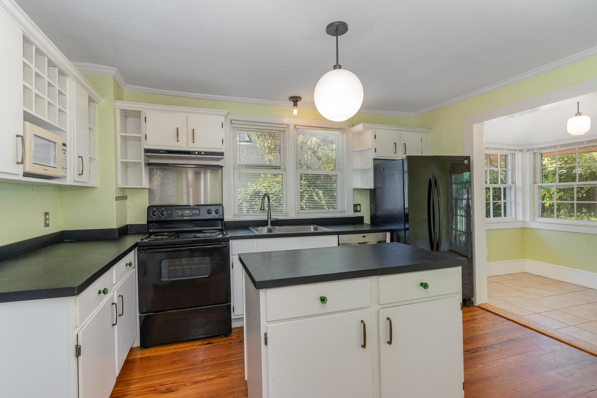 519 Holden Street Raleigh, NC 27604 - Photo 10 of 23 a kitchen with stainless steel appliances granite countertop a sink a stove and a refrigerator