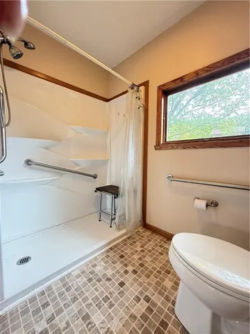 a view of a room with a large window