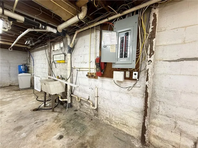 a view of storage and utility room with washer and dryer