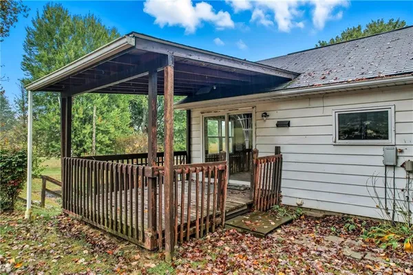 a view of a porch with wooden floor