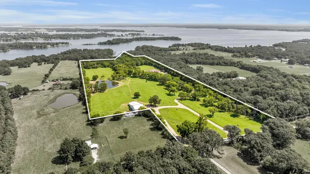 an aerial view of a house with a swimming pool