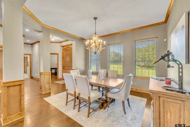 a living room with furniture a fireplace and a table