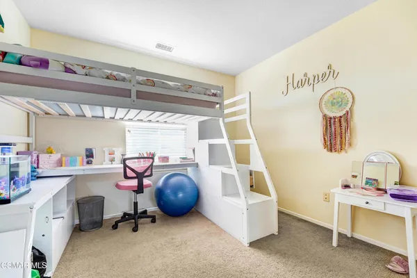 a bedroom with furniture and a window