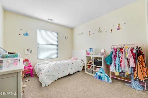 wooden view of a bedroom with baby toys