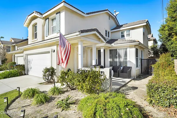front view of a house with a small yard