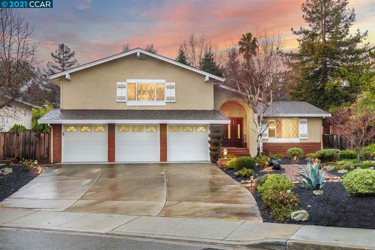 625 Santander Drive San Ramon, CA 94583 - Photo 1 of 1 a front view of a house with a yard and a garage