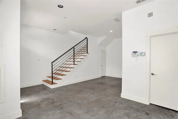 a view of a hallway with staircase