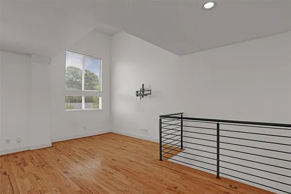 a view of a livingroom with wooden floor