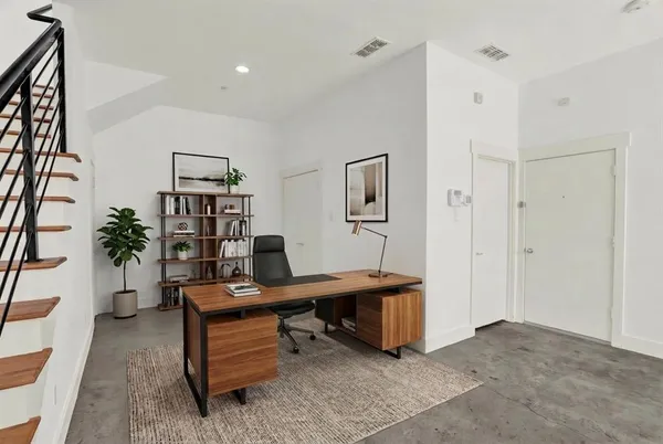 a view of a workspace with furniture